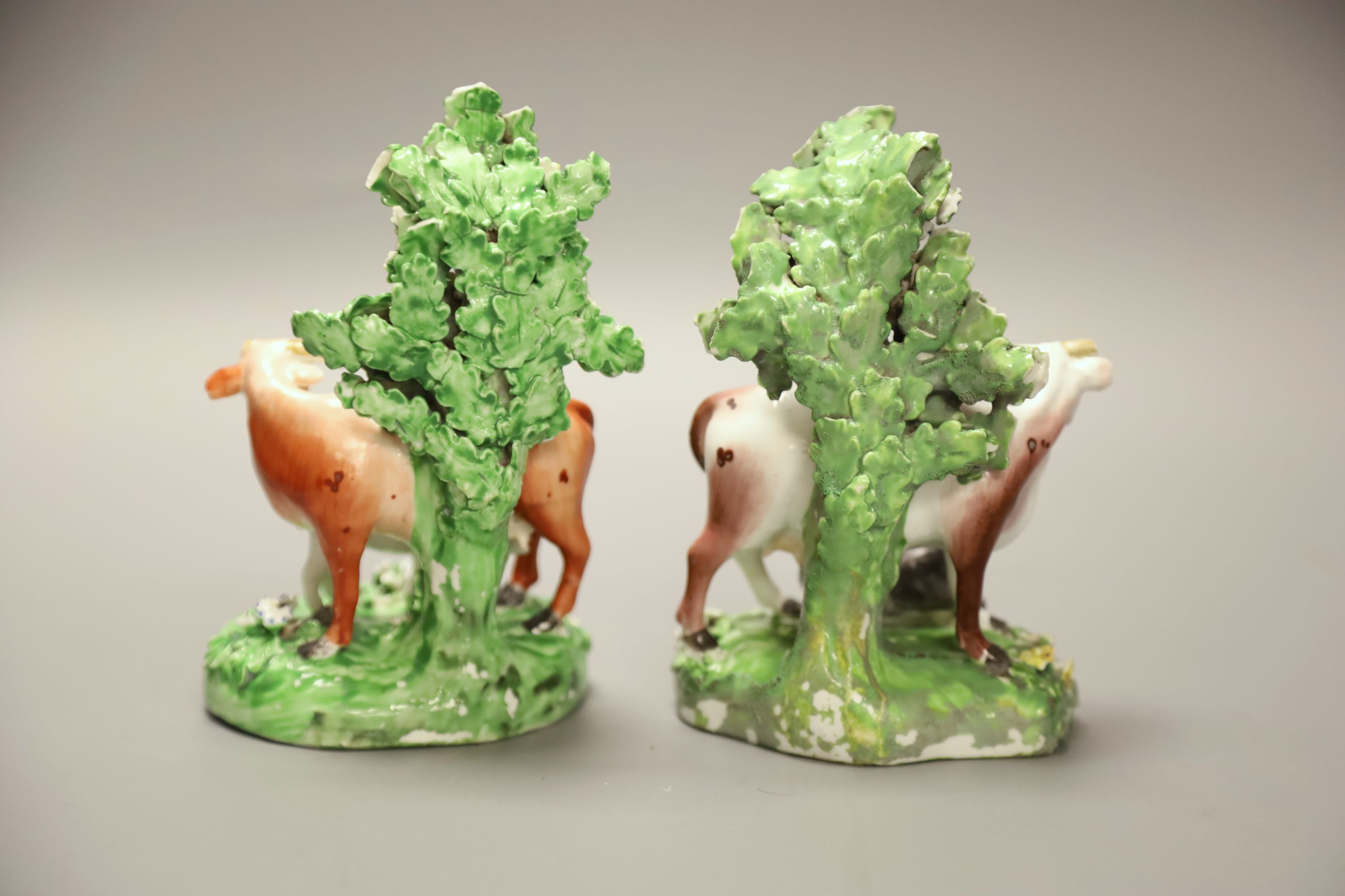 A 19th century Derby pair of cow and calf groups, height 15cm